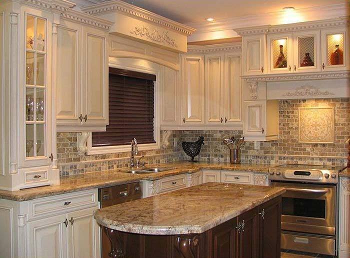 Limestone Tile Backsplash Paired with ivory cabinets