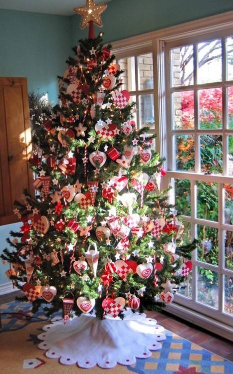 If you don't have enough floor space for a large Christmas tree, a small  metal spiral ornament tree with a matching star tree topper is a clever  option