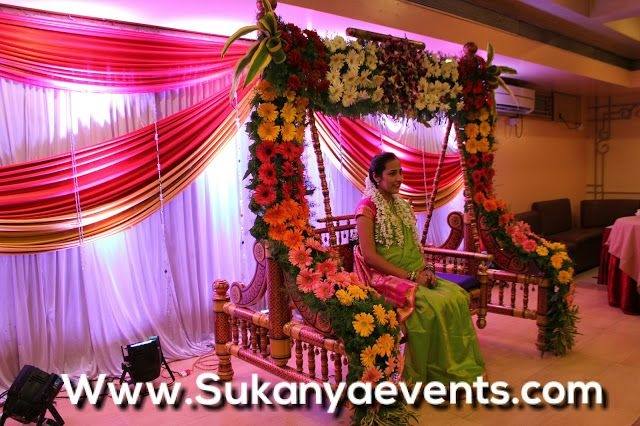 and in our decor along with the traditional decor of a Swing covered  with flowers, plus the flower props and of course me dress up in a green  saree with
