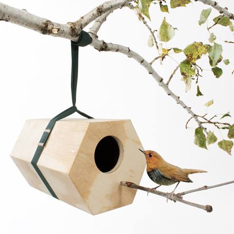 This decorative bird house is shaped as a square, however its design  doesn't lack imagination; every aspect of our feathered friends has been  thought of,