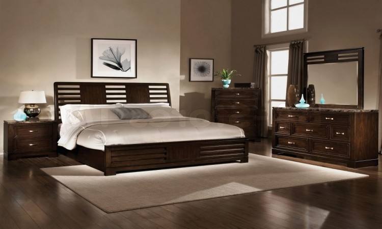 Dark furniture, light walls, neutral bedding