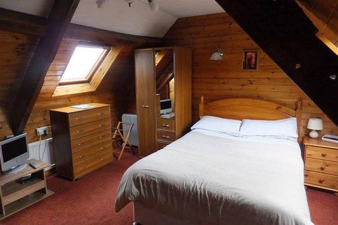 The custom castle  features a cozy loft bed nestled within fortress walls and a slid… | KRAZY!