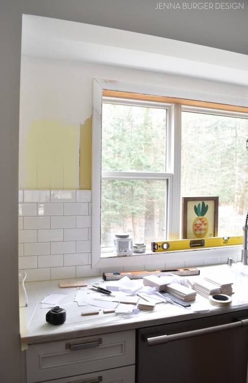 glass and mosaic tile backsplash white kitchen cabinets