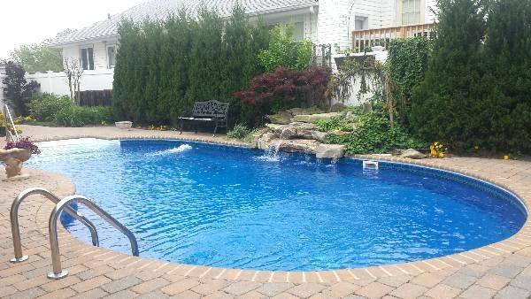 Backyard Swimming Pool Designs | Backyard natural lagoon inground pool and waterfall designs and
