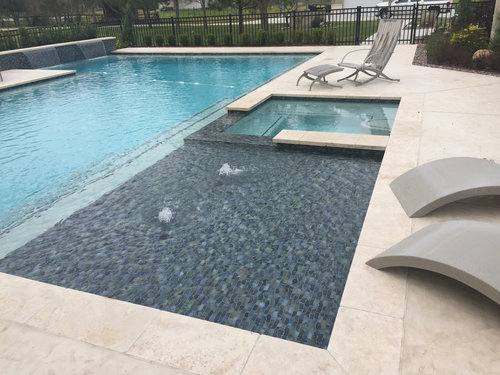 This style of step offers more of a concrete pool look and custom  design