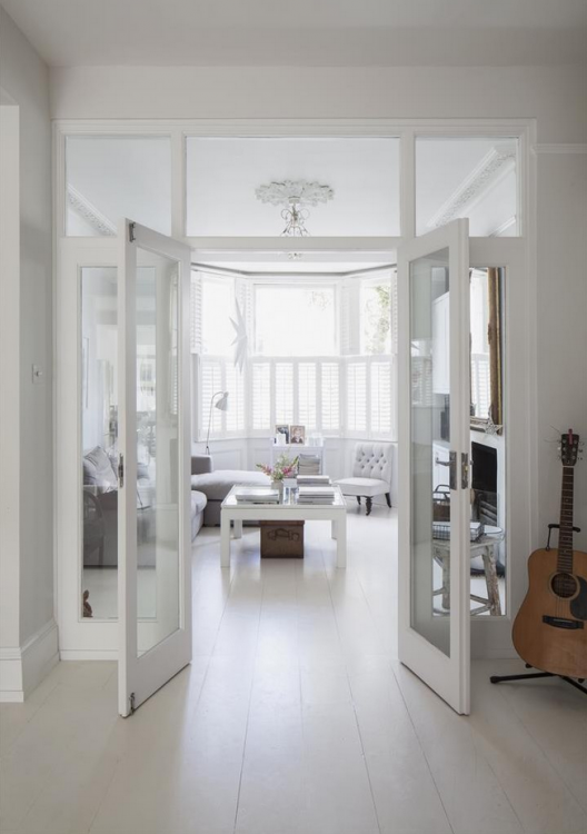 Custom doors used as room dividers can be folded away when not needed [ Design: