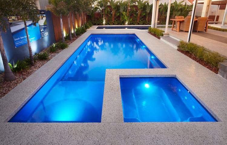 Small contemporary side rectangular swimming pool in Hamburg with decking