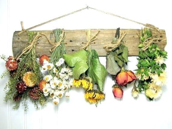 The second way I'm using dried flowers to decorate is by simply hanging them from a piece of fishing line, creating a really nice floral element
