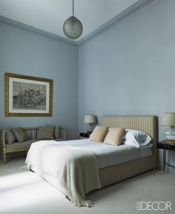 Light beige and wood bedroom with grey rug and light grey bedding