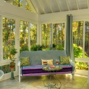 Unique coffee tables crafted from twigs steals the show in this rustic  sunroom [Design: