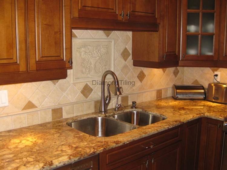 A large marble slab displays a classic cooktop backsplash design detailed  with pencil tiles