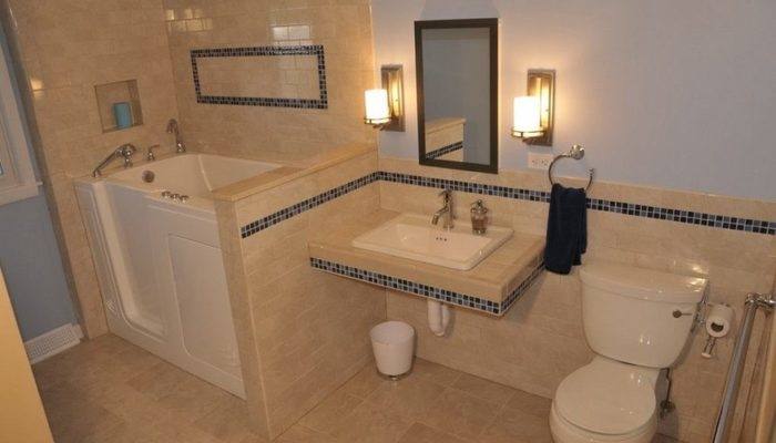 The brown wood flooring design captures this pure white bathroom scheme