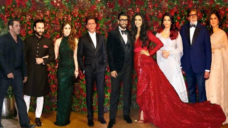 Indian Bollywood actor Saif Ali Khan (L) with his wife Kareena Kapoor Khan (R) attend the wedding of Soha Ali Khan (2nd L) and Kunal Khemu (2nd R) in Mumbai