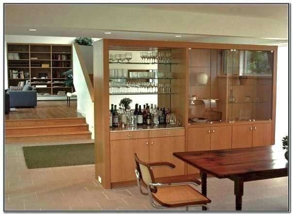 An open divider cabinet is above the counter between the kitchen and dining room