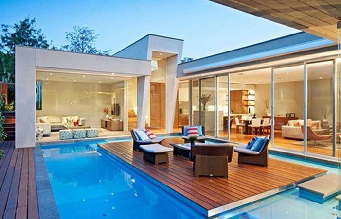 Having a seating area next to the pool is hardly unusual, however a terrace that creates a visual connection between pool and home is an underused design