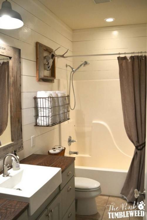 Classic chandelier, unique bathtub and farmhouse charm shape a relaxing bathroom [From: Illuminations