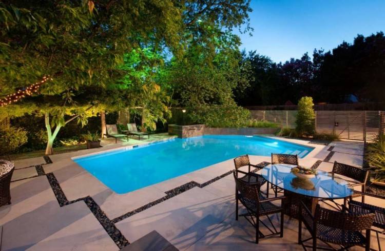 Water feature elevates the aesthetic appeal of the gorgeous pool [Design:  The Pool Craft