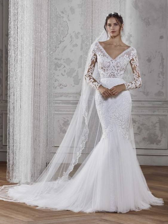 Breathtaking embellished white wedding dress with elegant slit tulle skirt; Featured Dress: Limor Rosen