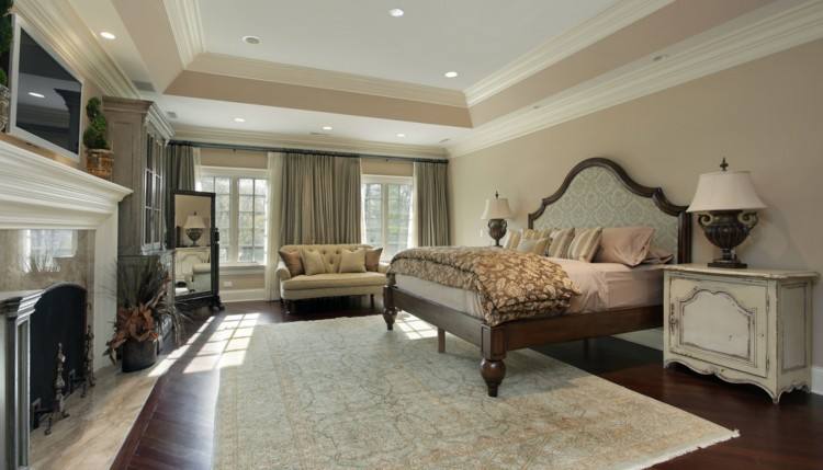 Large master bedroom with light wood floor and shag area rug
